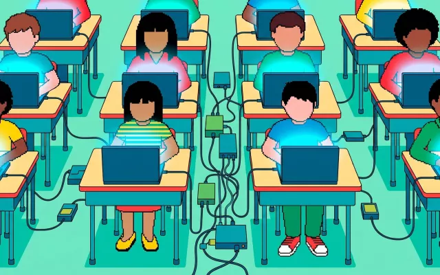 Niños utilizando dispositivos electrónicos en un aula.